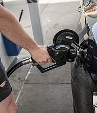 A customer refuels at a Chevron gas station in San Francisco, California, US, on Tuesday, Nov. 21, 2023.
Mandatory Credit:	David Paul Morris/Bloomberg/Getty Images