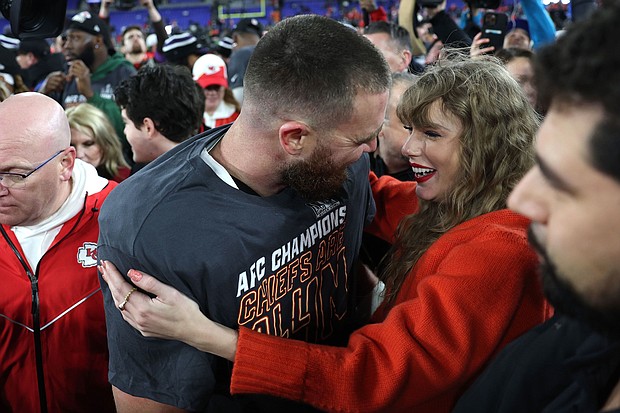 (From left) Travis Kelce and Taylor Swift celebrating on the field in Baltimore on Sunday as the Chiefs advance to the Super Bowl.
Mandatory Credit:	Patrick Smith/Getty Images