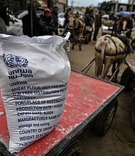 A bag of flour at the area where UNRWA distributes flour to families as Israeli attacks continue in Rafah, Gaza on January 28.
Mandatory Credit:	Abed Zagout/Anadolu Agency/Getty Images