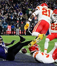 Baltimore Ravens wide receiver Zay Flowers (4) falls as he fumbles into the end zone for a touchback against the Kansas City Chiefs during the second half of the AFC Championship NFL football game, Sunday, Jan. 28, 2024, in Baltimore.
Mandatory Credit:	Nick Wass/AP
