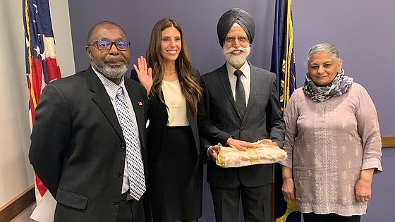 Amrith Kaur Aakre (second from left) poses during her swearing-in ceremony as the director of the EEOC’s Chicago District on Jan. 29, with Thomas Colclough, director of field management programs, and her parents Rajinder and Navinder Mago. Aakre took her oath on the Sikh holy book, the Guru Granth Sahib.