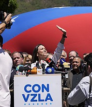 Opposition coalition presidential hopeful Maria Corina Machado gives a press conference outside her campaign headquarters in Caracas, Venezuela, Monday, January 29.
Mandatory Credit:	Ariana Cubillos/AP