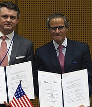 Chris McKee, Senior Vice President, Strategy and Business Development, MD Anderson and Rafael Mariano Grossi, IAEA Director General.