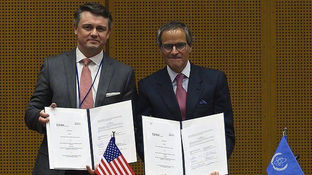 Chris McKee, Senior Vice President, Strategy and Business Development, MD Anderson and Rafael Mariano Grossi, IAEA Director General.