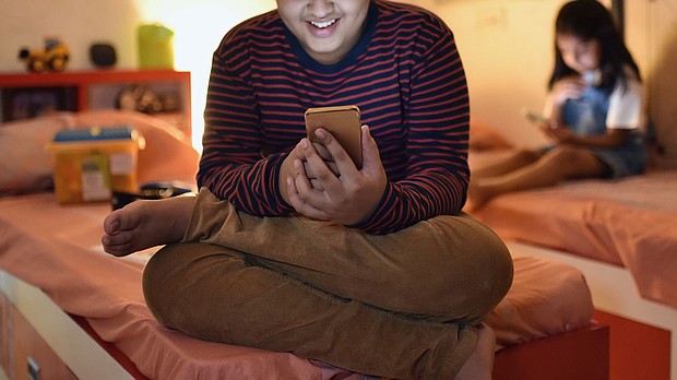 Parents should look for ways to bridge kids' online and offline lives, experts say. Connecting online can be a lifesaver for boys who don't find friendship at school.
Mandatory Credit:	Mayur Kakade/Moment RF/Getty Images