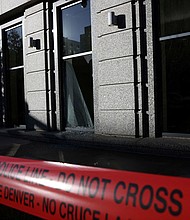 Police tape surrounds an area where a man broke into the Colorado Supreme Court building and barricaded himself inside overnight in Denver, Colorado.
Mandatory Credit:	Kevin Mohatt/Reuters