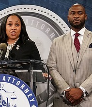 Fulton County District Attorney Fani Willis speaks at a press conference next to prosecutor Nathan Wade after a Grand Jury brought back indictments against former president Donald Trump and his allies in their attempt to overturn the state's 2020 election results, in Atlanta, Georgia, on August 14, 2023.
Mandatory Credit:	Elijah Nouvelage/Reuters/File