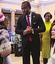 Richmond Mayor Levar Stoney and his wife, Brandi, greet audience members after his address.