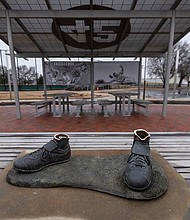 The feet from the Jackie Robinson statue, seen here on January 26, were left behind.
Mandatory Credit:	Travis Heying/TNS/Zuma Press