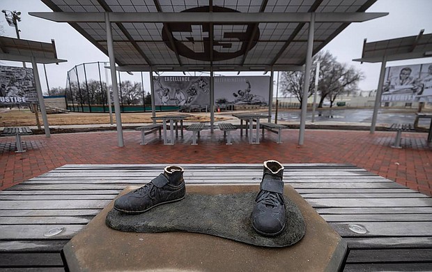 The feet from the Jackie Robinson statue, seen here on January 26, were left behind.
Mandatory Credit:	Travis Heying/TNS/Zuma Press
