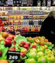 People shop in a supermarket in the Manhattan borough of New York city on January 27, 2024.
Mandatory Credit:	Charly Triballeau/AFP/Getty Images