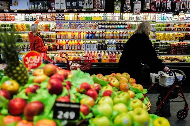 People shop in a supermarket in the Manhattan borough of New York city on January 27, 2024.
Mandatory Credit:	Charly Triballeau/AFP/Getty Images