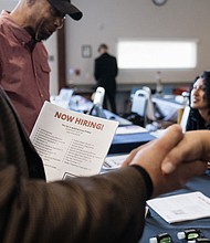 Attendees shake hands at a Veteran Employment and Resource Fair in Long Beach, California, on January 9, 2024.
Mandatory Credit:	Eric Thayer/Bloomberg/Getty Images