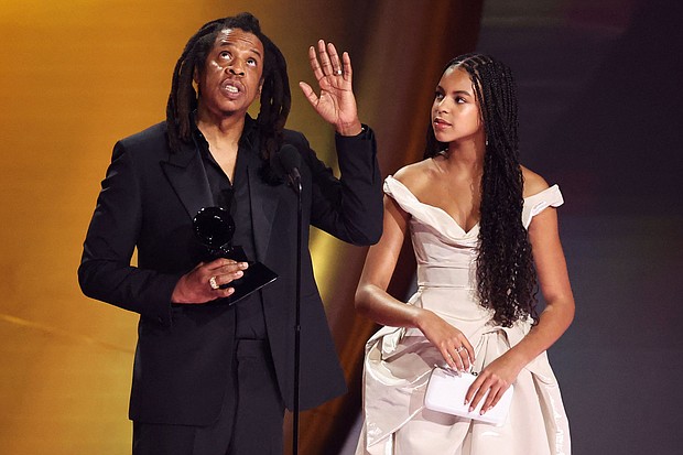 Jay Z accepts the Dr. Dre Global Impact Award as his daughter Blue Ivy Carter looks on during the 66th Annual Grammy Awards.
Mandatory Credit:	Mike Blake/Reuters