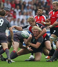 Alix Popham of Wales offloads as he is wrapped up by Pat Riordan of Canada during the Rugby World Cup 2007 Pool B match between Wales and Canada in Nantes, France.
Mandatory Credit:	Stu Forster/Getty Images Europe/Getty Images