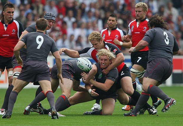 Alix Popham of Wales offloads as he is wrapped up by Pat Riordan of Canada during the Rugby World Cup 2007 Pool B match between Wales and Canada in Nantes, France.
Mandatory Credit:	Stu Forster/Getty Images Europe/Getty Images