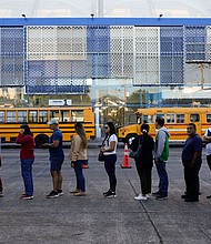 Voters line up at a polling station during general elections in San Salvador, El Salvador, on Sunday.
Mandatory Credit:	Moises Castillo/AP