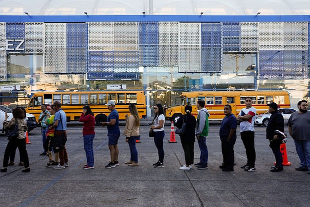 Voters line up at a polling station during general elections in San Salvador, El Salvador, on Sunday.
Mandatory Credit:	Moises Castillo/AP