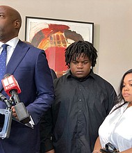 Attorney Cory Lynch, left, joined by Treveon Isaiah Taylor, Sr., Jessica Ross, speaks during a news conference in August 2023 in Atlanta.
Mandatory Credit:	Sudhin Thanawala/AP/File