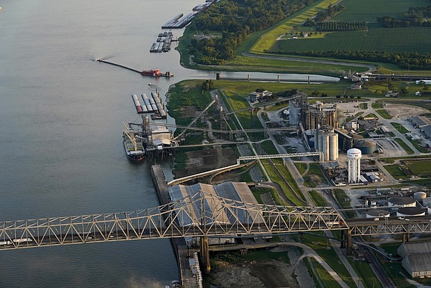 Barges sit docked at the Louis Dreyfus Holding Co. along the Mississippi Riverlast year in Port Allen, La. Louis Dreyfus and other commodity traders have scooped up millions of dollars’ worth of soy, corn and wheat straight from prison farms.