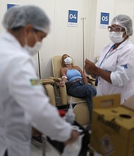 Nurses attend to patients at a dengue emergency medical care unit in Rio de Janeiro, Brazil, on February 6.
Mandatory Credit:	Pilar Olivares/Reuters