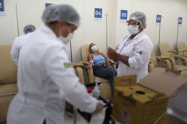 Nurses attend to patients at a dengue emergency medical care unit in Rio de Janeiro, Brazil, on February 6.
Mandatory Credit:	Pilar Olivares/Reuters