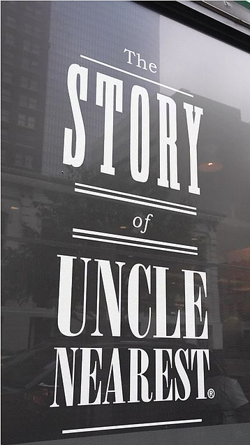 One of several full “Taste of History” window wraps at Taste Kitchen + Bar displaying the remarkable story of Uncle Nearest at 420 Main Street in the heart of Downtown Houston.