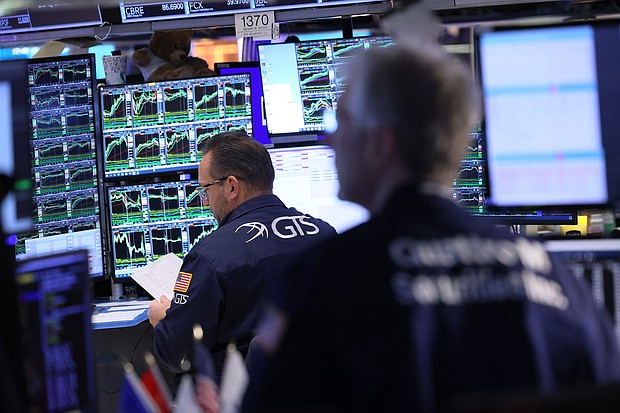 Traders work on the floor of the New York Stock Exchange
Mandatory Credit:	Michael M. Santiago/Getty Images