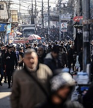 A crowded street in Rafah, where many displaced Palestinians have trekked as the IDF's ground campaign moved south through Gaza.
Mandatory Credit:	Mahmud Hams/AFP/Getty Images