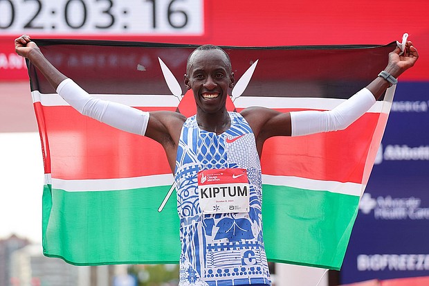 Kelvin Kiptum celebrates after winning the 2023 Chicago Marathon professional men's division and setting a world record marathon time of 2:00.35 at Grant Park on October 8, 2023 in Chicago, Illinois.
Mandatory Credit:	Michael Reaves/Getty Images
