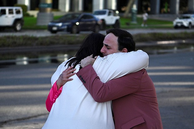 Carlos Gonzalez, a worship singer, hugs a fellow churchgoer after a shooting at Joel Osteen's Lakewood Church in Houston.
Mandatory Credit:	Callaghan O'Hare/Reuters