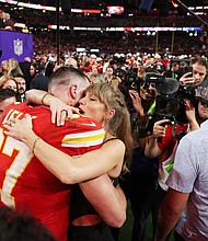Travis Kelce of Kansas City Chiefs and Taylor Swift embrace after defeating the San Francisco 49ers in overtime during Super Bowl LVIII.
Mandatory Credit:	Ezra Shaw/Getty Images