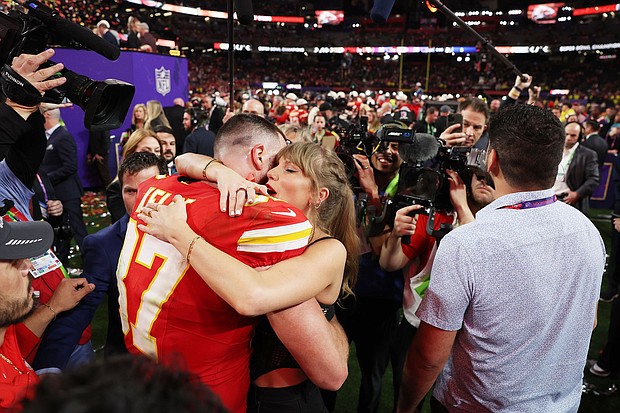 Travis Kelce of Kansas City Chiefs and Taylor Swift embrace after defeating the San Francisco 49ers in overtime during Super Bowl LVIII.
Mandatory Credit:	Ezra Shaw/Getty Images