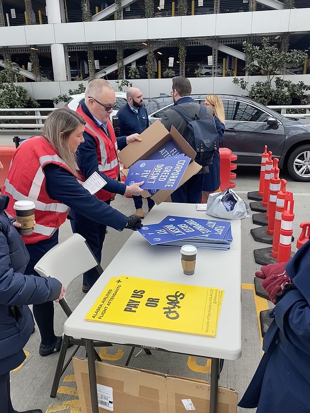 Steve Maller prepares picket signs today at the Portland, Oregon, airport.
Mandatory Credit:	Courtesy Association of Flight Attendants-CWA