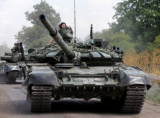 Russian tanks drive near the settlement of Olenivka in Donetsk region, Ukraine, July 2022.
Mandatory Credit:	Alexander Ermochenko/Reuters