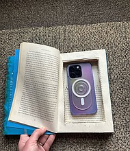 An example of a phone hidden in a hollowed-out book. Librarian Molly Riportella hopes to get the phones to abused women throughout her area and beyond.
Mandatory Credit:	Courtesy Molly Riportella/BiblioUnderground