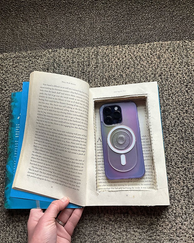An example of a phone hidden in a hollowed-out book. Librarian Molly Riportella hopes to get the phones to abused women throughout her area and beyond.
Mandatory Credit:	Courtesy Molly Riportella/BiblioUnderground