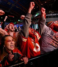 Kansas City Chiefs fans celebrate as their team defeats the San Francisco 49ers in Super Bowl LVIII during the Red Kingdom Block Party at the Power and Light District on February 11, in Kansas City, Missouri.
Mandatory Credit:	Reed Hoffmann/Getty Images