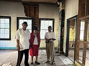 Rev. George Magazine, Prince Wallace and James Marrow stand in the abandoned Mt. Zion School in Charles City County. They are members of the Historic Mt. Zion School Foundation of Charles City that is seeking to restore and preserve the school.