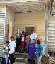 Hancy Hatchett, the Rev. George Magazine, Nancy Phaup, Prince Wallace, Sylvia Bradby Christian, James Marrow, Melinda Brown and Gwen Christian stand at the former Mt. Zion School, which many of their ancestors attended.