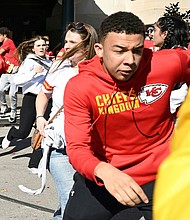 People flee after shots were fired near the area where a pep rally was held for the Kansas City Chiefs on Wednesday, February 14.
Mandatory Credit:	Andrew Caballero-Reynolds/AFP/Getty Images