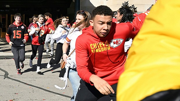 People flee after shots were fired near the area where a pep rally was held for the Kansas City Chiefs on Wednesday, February 14.
Mandatory Credit:	Andrew Caballero-Reynolds/AFP/Getty Images
