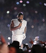 Usher performs Sunday during halftime of Super Bowl LVIII in Las Vegas.