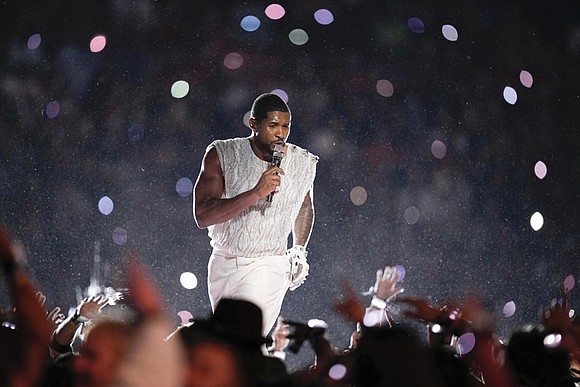 Usher emerged at Las Vegas’ Allegiant Stadium for the Super Bowl halftime show seated on a throne, joined by a ...