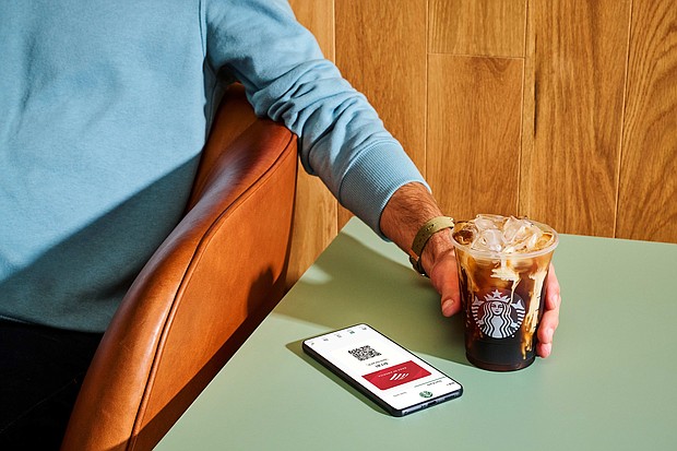 Starbucks and Bank of America are partnering for expanded rewards.
Mandatory Credit:	Bank of America/Starbucks
