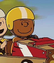 This image released by Apple TV+ shows “Peanuts” characters Charlie Brown, left, and Franklin in a scene from the animated special “Snoopy Presents: Welcome Home, Franklin,” premiering Friday.