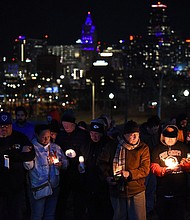 People attend a candlelight vigil at Skywalk Memorial Plaza in Kansas City, Missouri, on Thursday.
Mandatory Credit:	Emmalee Reed/CNN