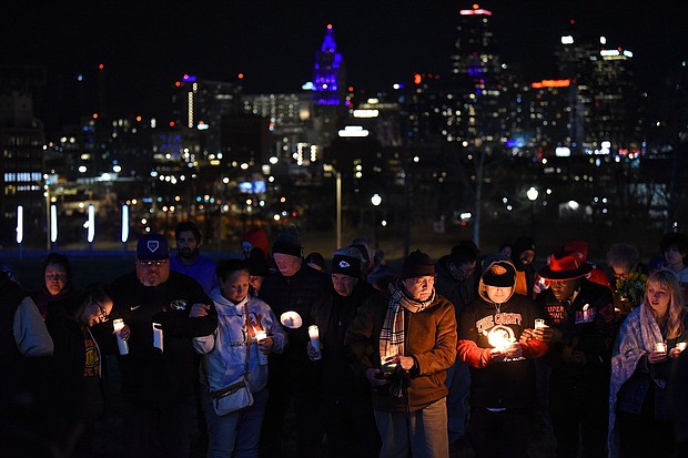 People attend a candlelight vigil at Skywalk Memorial Plaza in Kansas City, Missouri, on Thursday.
Mandatory Credit:	Emmalee Reed/CNN