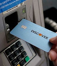 Capital One is acquiring Discover Financial Services in a $35.3 billion deal.
Mandatory Credit:	Rogelio V. Solis/AP/File