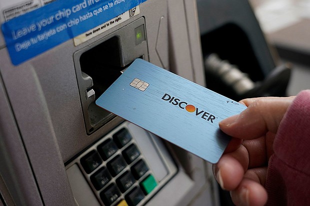 Capital One is acquiring Discover Financial Services in a $35.3 billion deal.
Mandatory Credit:	Rogelio V. Solis/AP/File